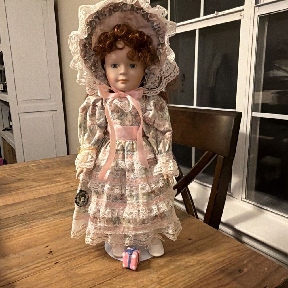 VTG Brinn’s 1986 Vintage Porcelain Doll Red Hair Bonnet Prairie Dress w Stand